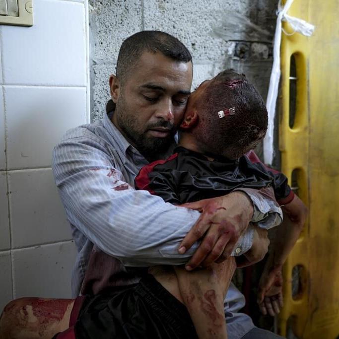A boy in Gaza was killed by an Israeli airstrike. His father held him and wouldn't let go